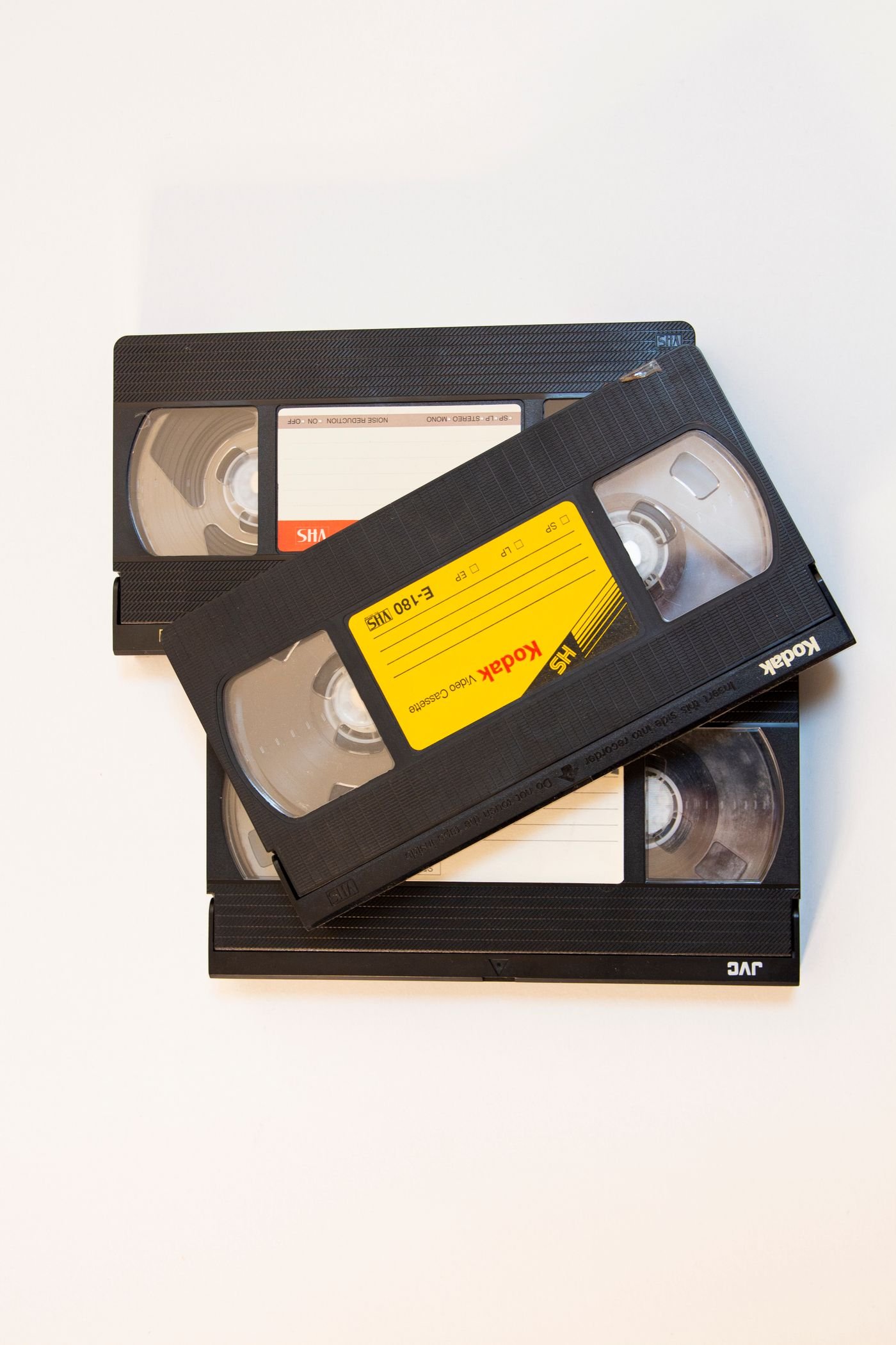 A small stack of VHS cassettes, the sort that turns up in a carrier bag at the back of a cupboard